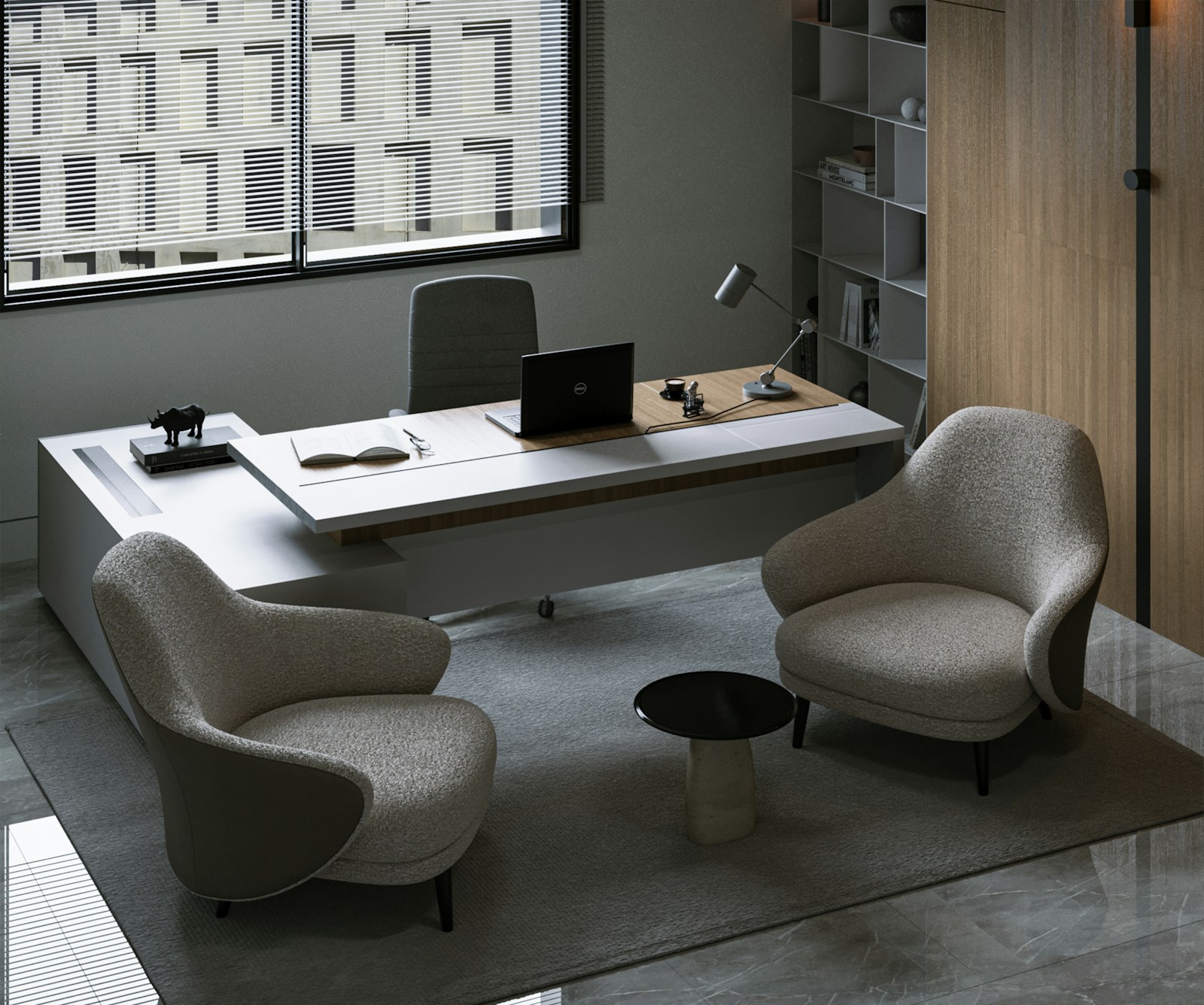 A quiet contemporary workspace with a laptop and comfortable chairs